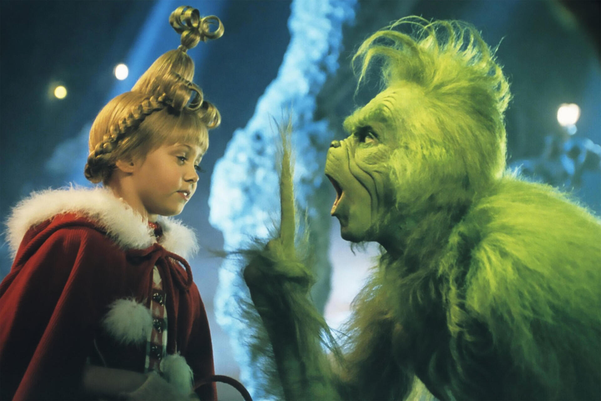 A picture of the Grinch speaking to Cindy Lou.